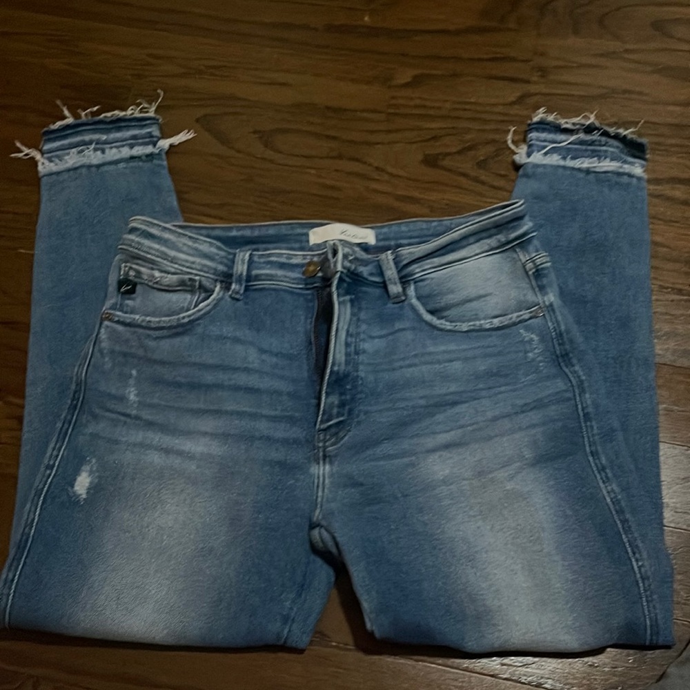 Light jeans with distressed bottom